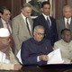 Yashwant Sinha giving his budget the final touches in his office, surrounded by his staff, on Feb.27, 2002.